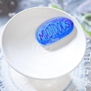 Mudsponge Blue Workhorse is a durable, eco-friendly, absorbent sponge shaped like a potter’s rib. Expands with water. Amaranth Stoneware Canada.