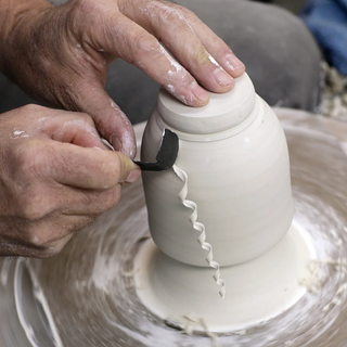 Japanese-inspired versatile trim tool with a sharp spade edge for precision and curl for smoothing and detailing. Amaranth Stoneware Canada.