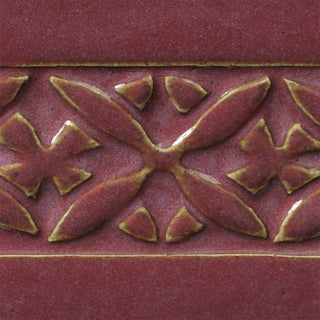 Chun Plum is a pink-red translucent glaze that breaks light tan over textures. Amaranth Stoneware Canada.