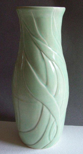 Aqua by Coyote on white porcelain. Aqua glaze, translucent blue-green similar to celadon. Amaranth Stoneware Canada.
