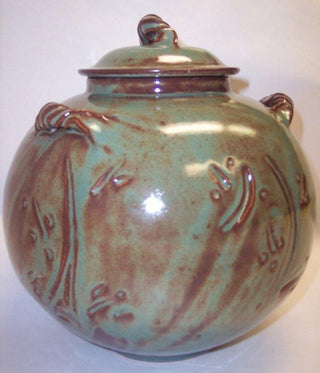 A mint green Shino glaze that breaks to brown where thinner. One of our most popular glazes! Amaranth Stoneware Canada.