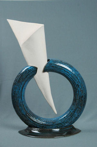 A black base that transforms into a deep, variegated cobalt blue when applied thick. Perfect for various ceramic creations. Amaranth Stoneware Canada.