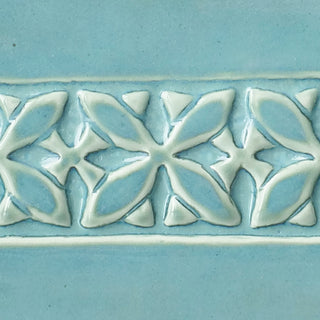 Cool Blue Lagoon glaze with milky green breaking to light blue over texture, creating tidal effects. Amaranth Stoneware Canada.