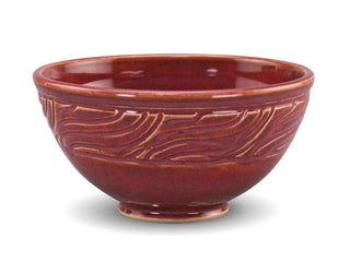 Chun Plum is a pink-red translucent glaze that breaks light tan over textures. Amaranth Stoneware Canada.