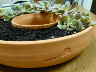 Handcrafted 7.5x2-inch Living Wreath terra cotta planter, perfect for succulents. Great drainage and ideal for indoor or outdoor decor. Handcrafted in Kingston, Ontario at Amaranth Stoneware.