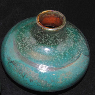 A deep, mottled green glaze that creates a rich variegated surface, especially when paired with the Archie's Base. Amaranth Stoneware Canada.