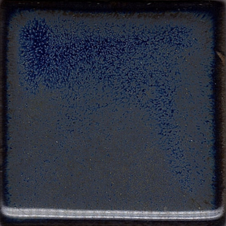 Antares glaze, deep blue with starry crystals and bronze tones. Amaranth Stoneware Canada.