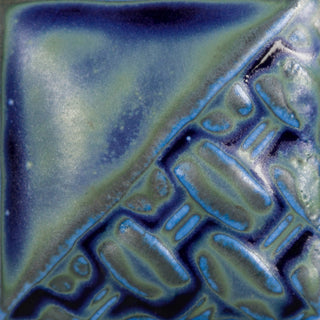 Cone 6: Soft matte cobalt blue glaze that pools dark and glossy, breaking to light brown. Cone 10: Changes to green where thin and remains dark blue where thick, with increased movement. Amaranth Stoneware Canada.