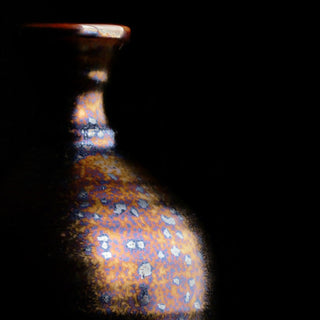 Dark Star is a fluid, dark matte glaze with iridescent crystals like a beetle shell. Breaks translucent. Amaranth Stoneware Canada.
