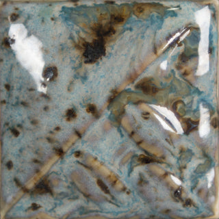 Cone 6: Semi-opaque sky blue gloss glaze with melting brown crystals; base color darkens, and crystals become darker and more defined at Cone 10. Amaranth Stoneware Canada.