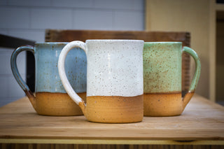 Practical Bee mugs: speckled tan clay, farmhouse-inspired glazes, microwave/dishwasher safe, 4.5" x 3". Handmade in Kingston, Ontario at Amaranth Stoneware.