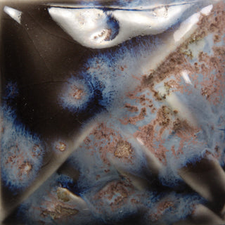 Cone 6: Semi-transparent charcoal gloss glaze with a three-tone crystal of white, orange, and blue; showcases more blue hues with melted crystals at Cone 10. Amaranth Stoneware Canada.