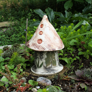 Handcrafted 7x4-inch Ladybug Castle with removable lid, perfect for creating a sanctuary for ladybugs in your garden. Weatherproof and handcrafted in Kingston, Ontario at Amaranth Stoneware.