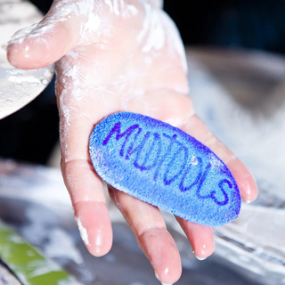 Mudsponge Blue Workhorse is a durable, eco-friendly, absorbent sponge shaped like a potter’s rib. Expands with water. Amaranth Stoneware Canada.