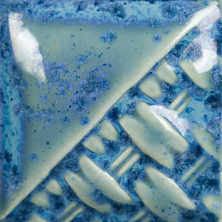 Micro Cerulean Cone 6 oxidation glaze, glossy translucent medium blue with aqua float and blue micro-crystallization; turns variegated grey/blue at Cone 10 reduction. Amaranth Stoneware Canada.