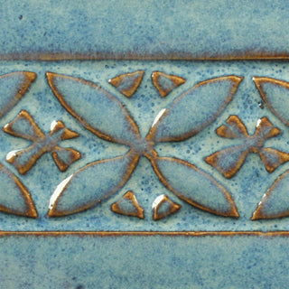 Blue Rutile is a flowing blue glaze that breaks to brown on thinner areas, ideal for texture and layering. Amaranth Stoneware Canada.
