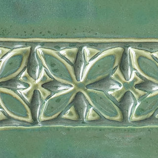 Glossy Emerald Falls glaze, breaking to mauve grey-green, with moss-like surface variations. Amaranth Stoneware Canada.