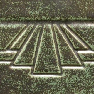 Art Deco Green is a glossy, light blue-green glaze that floats metallic spots. Amaranth Stoneware Canada.