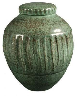 Art Deco Green is a glossy, light blue-green glaze that floats metallic spots. Amaranth Stoneware Canada.