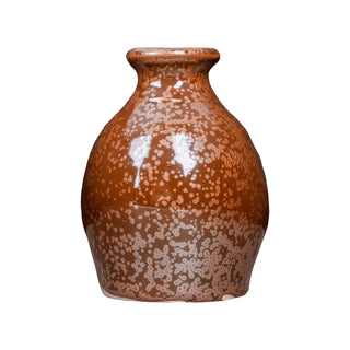 Ancient Copper is an iridescent iron red glaze that breaks dark brown over texture and pools dark yellow-green, creating a weathered look. Amaranth Stoneware Canada.