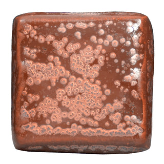 Ancient Copper is an iridescent iron red glaze that breaks dark brown over texture and pools dark yellow-green, creating a weathered look. Amaranth Stoneware Canada.