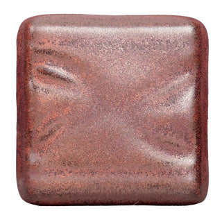 Ancient Copper is an iridescent iron red glaze that breaks dark brown over texture and pools dark yellow-green, creating a weathered look. Amaranth Stoneware Canada.