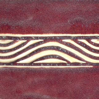 Copper Red glaze, oxblood hue with clear breaks on edges, mimicking reduction effects. Amaranth Stoneware Canada.