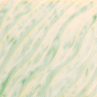 Glossy cream and green-mottled glaze, breaking on texture with peachy float, great for layering. Amaranth Stoneware Canada.