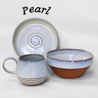 Red stoneware inspired by Kingston’s redbrick homes. Mugs, plates, bowls in 3 colors. Microwave/dishwasher safe. Handmade in Kingston, Ontario at Amaranth Stoneware.