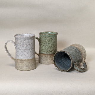 Practical Bee mugs: speckled tan clay, farmhouse-inspired glazes, microwave/dishwasher safe, 4.5" x 3". Handmade in Kingston, Ontario at Amaranth Stoneware.