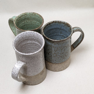 Practical Bee mugs: speckled tan clay, farmhouse-inspired glazes, microwave/dishwasher safe, 4.5" x 3". Handmade in Kingston, Ontario at Amaranth Stoneware.