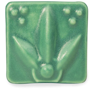 Satin Matte Teal glaze, an opaque, buttery blue-green, enhances textured ware with a classic art deco look. Amaranth Stoneware Canada.