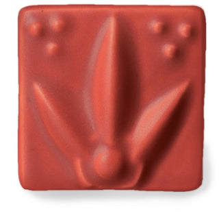 Satin Matte Cayenne glaze, a semi-opaque spicy red with earthy terracotta tones, breaks slightly over edges, enhancing texture. Amaranth Stoneware Canada.