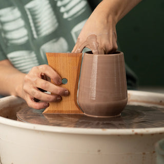 The Wine Tumbler Tool shapes perfect stemless wine glasses with two curved sides for red, white, or bubbles. 5” x 3.5”, made of maple wood. Handmade in St. Louis, MO. Amaranth Stoneware Canada.