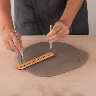 The Compass Tool cuts or scribes 24 sizes of circles from 1/2" to 12" in diameter. Made from maple wood, 7” x 1.125”, versatile for hand-building and wheel throwing. Handmade in St. Louis, MO. Amaranth Stoneware Canada.