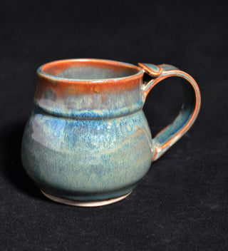 Andromeda glaze, deep blue-green with brown tones and gold crystals. Amaranth Stoneware Canada.