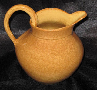 Warm yellow glaze that breaks to brown over texture. Ideal for layering with darker colors, offering a signature Shino look. Amaranth Stoneware Canada.