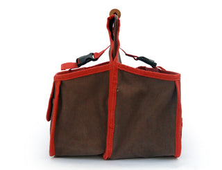 The Xiem Art Bag is a durable, breathable solution for ceramic tool storage. Features 17 pockets, 16 holsters, 2 large compartments, secure straps, and a reinforced bottom. Holds up to 25 lbs. Measures 16" x 9" x 12". Amaranth Stoneware Canada.