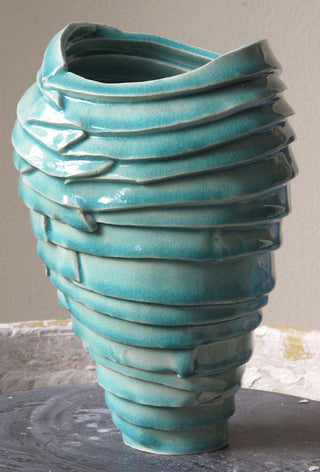 Crazed Copper glaze, a lighter translucent glaze with fine crazing, pooling in textures and firing red in reduction. Amaranth Stoneware Canada.