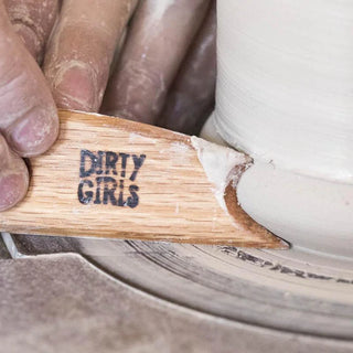 Big Foot Fetish Rib, a versatile wooden tool with beveled edges for controlled finishing on rims and galleys. Ideal for shaping and creating a foot for trimming. Amaranth Stoneware Canada.