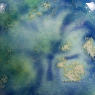 Cone 06: Opaque bright blue with green/yellow crystals; lightens at Cone 6 as crystals fade, enhancing mobility. Amaranth Stoneware Canada.