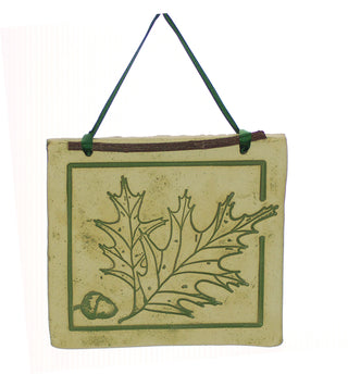 Handcrafted 4x4-inch stoneware Botanicals featuring seasonal plants and creatures. Finished with dogwood and ribbon. Weatherproof. Handcrafted in Kingston, Ontario at Amaranth Stoneware.