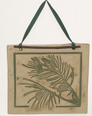 Handcrafted 4x4-inch stoneware Botanicals featuring seasonal plants and creatures. Finished with dogwood and ribbon. Weatherproof. Handcrafted in Kingston, Ontario at Amaranth Stoneware.