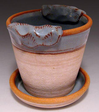 Light Blue Shino breaks to brown where thin, with pale blue in thicker areas. Great over texture. Amaranth Stoneware Canada.