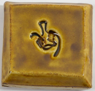 Amber glaze, a semi-transparent, glossy golden finish, appears light gold on porcelain, darker on white clay, and deep gold on red clay. Amaranth Stoneware Canada.