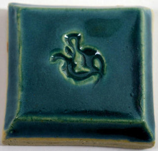 Aqua is an opaque, glossy blue-green glaze that breaks over texture. Amaranth Stoneware Canada.