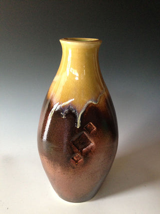 Bronze Temmoku glaze, dramatic shimmering bronze on white clays and dark on red clay. Amaranth Stoneware Canada.