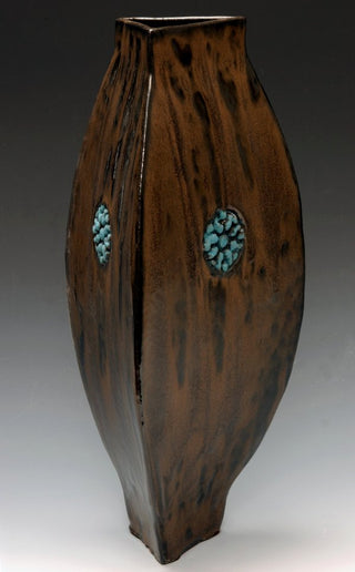 Espresso Bean glaze exhibits a variegated black and brown finish, perfect for pairing with bright colors or as a natural alternative to Black. Amaranth Stoneware Canada."