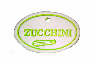 Colorful 3.5x2.5-inch weatherproof stoneware signs with green rustproof hangers. Handcrafted in Kingston, Ontario at Amaranth Stoneware.