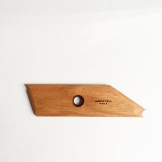 Foot 6 tool with flat angles for adding and supporting feet on your piece. Flat bottom for stability and rounded or oblong feet while spinning. 6" x 1.5", made of maple wood. Handmade in St. Louis, MO. Amaranth Stoneware Canada.